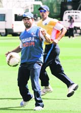Sachin Tendulkar plays soccer with Rahul Dravid (R) the day before their first Test match against New Zealand