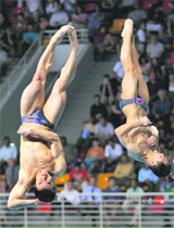 China�s Qin Kai (R) and Wang Feng compete in the men's 3m synchronized diving final during the FINA Diving World Series 2009 at the Hamad Aquatic Centre in Doha on Sunday.