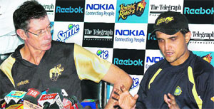 KKR coach John Buchanan looks on as Sourav Ganguly speaks during a press conference.