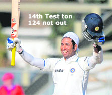 V.V.S. Laxman celebrates after scoring a century during the final day of the second Test on Monday.