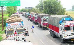 Trucks wait for their turn at the Attari joint check post