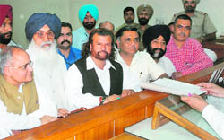 SAD candidate Hans Raj Hans, along with CM Parkash Singh Badal, BJP�s state in charge Balbir Punj, files nomination papers in Jalandhar on Tuesday.