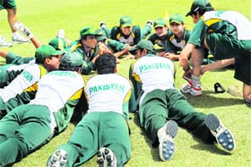 Pakistan players gather at the Dubai Cricket Stadium prior to a practice session on the eve of the first ODI against Australia