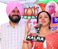 BJP star campaigner Hema Malini addresses a rally in support of Navjot Singh Sidhu in Amritsar on Sunday.