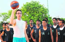 International basketball coach John David Walsh gives tips to the students at NIS, Patiala