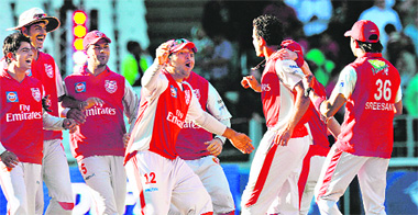 Kings XI�s captain Yuvraj Singh (C) approaches to hug Irfan Pathan (2nd R) as they celebrate their team's victory over Deccan Chargers at The Wanderers Stadium in Johannesburg on Sunday.