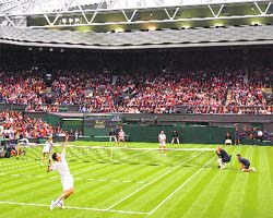 Tim Henman in action on centre court during the launch of the new retractable roof at the All England Lawn Tennis Club on Sunday.