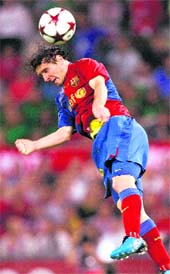 CLINCHING HEADER: Barcelona�s Lionel Messi scores a goal against Manchester United at the Olympic Stadium. Messi scored maximum number of nine goals in Champions League. 