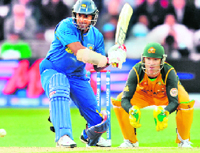 Kumar Sangakkara (L) plays a shot against Australia at Trent Bridge on Monday.