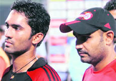 Dinesh Karthik (L) has been named as Virender Sehwag�s replacement.