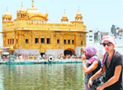 Foreign tourists at the Golden Temple in Amritsar on Saturday. Photo: Vishal Kumar