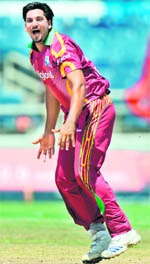 Ravi Rampaul celebrates after dismissing Ravindra Jadeja on Sunday.
