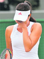 Ana Ivanovic reacts after her match against Venus Williams on Monday. Ivanovic withdrew due to injury.