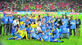 Brazilian players celebrate with the trophy  on Sunday.