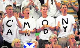 Fans of Andy Murray watch his match against Stanislas Wawrinka at the Wimbledon tennis championships in London on Monday.