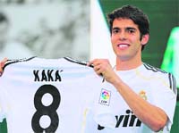 Brazilian midfielder Kaka shows his Real Madrid new jersey number 8 during his official presentation