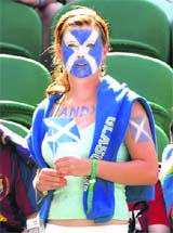 A fan waits on Centre Court for the match between Andy Murray and Juan Carlos Ferrero at the Wimbledon tennis championships, in London 