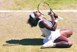 Serena Williams celebrates after beating Venus Williams on Saturday.