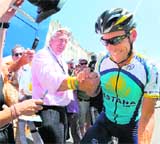 Kazakh cycling team Astana�s rider Lance Armstrong receives support from a fan at his team bus on Monday in Marseille. 