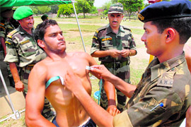 A youth appears for a fitness test during a Territorial Army recruitment rally at Dogra grounds, Jalandhar, on Tuesday.