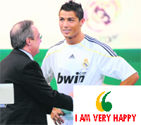 Cristiano Ronaldo (R) speaks to Real Madrid president Florentino Perez during his official presentation in Madrid on Monday.