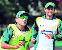 Pakistani cricketers Faisal Iqbal and Shoaib Malik take part in a practice session in Colombo on Sunday. 