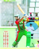 Bangladesh batsman Mahmudullah drives West Indies bowler Nikita Miller for 4 runs during the first ODI on Sunday. 