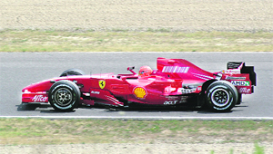 Formula One driver Michael Schumacher of Germany drives a 2007 model Ferrari on Mugello track north of Florence on Friday. 