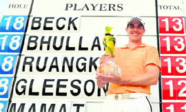 Dareen Beck of Australia holds up the winner's trophy at the Empire Hotel and Country Club in Jerudong on Sunday.