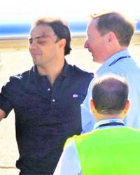 Ferrari Formula One driver Felipe Massa shakes hands before boarding a flight bound for Brazil, at the Budapest airport after being released from hospital