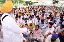 Balwant SIngh Nandgarh, Jathedar of Takht Damdama Sahib, adressing hardliners during a joint meeting to discuss the anti-Dera policies at village Jidda in Bathinda district on Friday.
