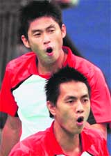 Indonesia�s Rian Sukmawan (L) and teammate Yonathan Suryatama react after missing a point against against China�s Chai Biao and Liu Xiaolong during the men�s doubles first round badminton match of the World Badminton Championship in Hyderabad