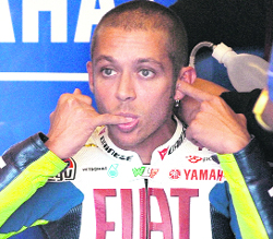 Valentino Rossi licks his finger ahead of the second free practice at the Czech Republic Moto GP on Saturday