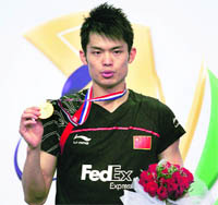 China�s Lin Dan poses with the winners� medal in Hyderabad on Sunday. � AFP
