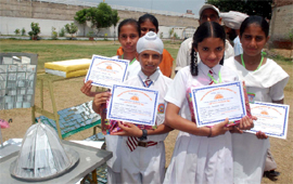 Students of Saint Soldier National Public School, Talwandi Sabo, who won model making contest in junior and senior categories, show their certificates in Bathinda on Thursday.