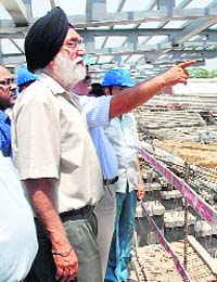 Sports Minister MS Gill inspects the progress of the construction work at the National Stadium in New Delhi