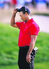 Tiger Woods of the U.S. reacts after missing a birdie putt on the 13th green during the final round of The Barclays golf tournament at Liberty National Golf Course in Jersey City on Sunday.