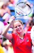 Kim Clijsters celebrates her victory against Viktoriya Kutuzova at the U.S. Open in New York on Monday.