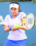 Sania Mirza in action against Olga Govortsova on Monday. 