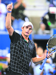 Andy Roddick gives a thumbs-up to the crowd after defeating Marc Gicquel during their evening match at the U.S. Open on Thursday