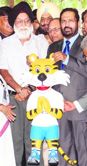 M.S. Gill (L) Union Minister for Sports and Suresh Kalmadi, president of IOA holds Common-wealth Games, mascot in New Delhi on Monday. 