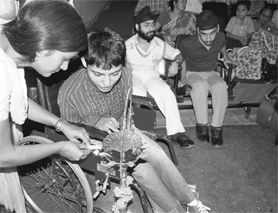 A child lights a ceremonial lamp at the parents meet in Ludhiana on Saturday.