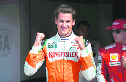 Force India�s Adrian Sutil celebrates finishing second after the qualifying session of the Italian Grand Prix.