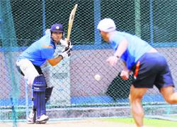 Yuvraj Singh (L) bats during a practice session at The R Premadasa Stadium in Colombo on Sunday. 