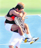 Leander Paes and Lukas Dlouhy celebrate on Sunday.