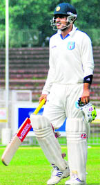 Virender Sehwag walks off after his dismissal on Sunday.