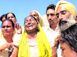 Residents of Shaheed Bhagat Singh Nagar protest against the demolition drive in Abohar on Saturday.