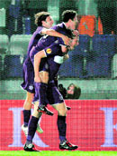 Austria Vienna's Schumacher (R) celebrates with his team mates after scoring against Nacional de Madeira during their Europa League match in Vienna on Thursday.