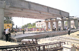 A beam forming part of a railway overbridge that fell on the Gidderbaha-New Delhi railway line at Malout