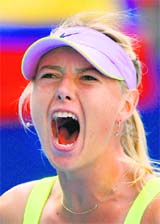 Maria Sharapova celebrates a point during her second round match against Victoria Azarenka at the China Open tennis tournament in Beijing on Tuesday. 